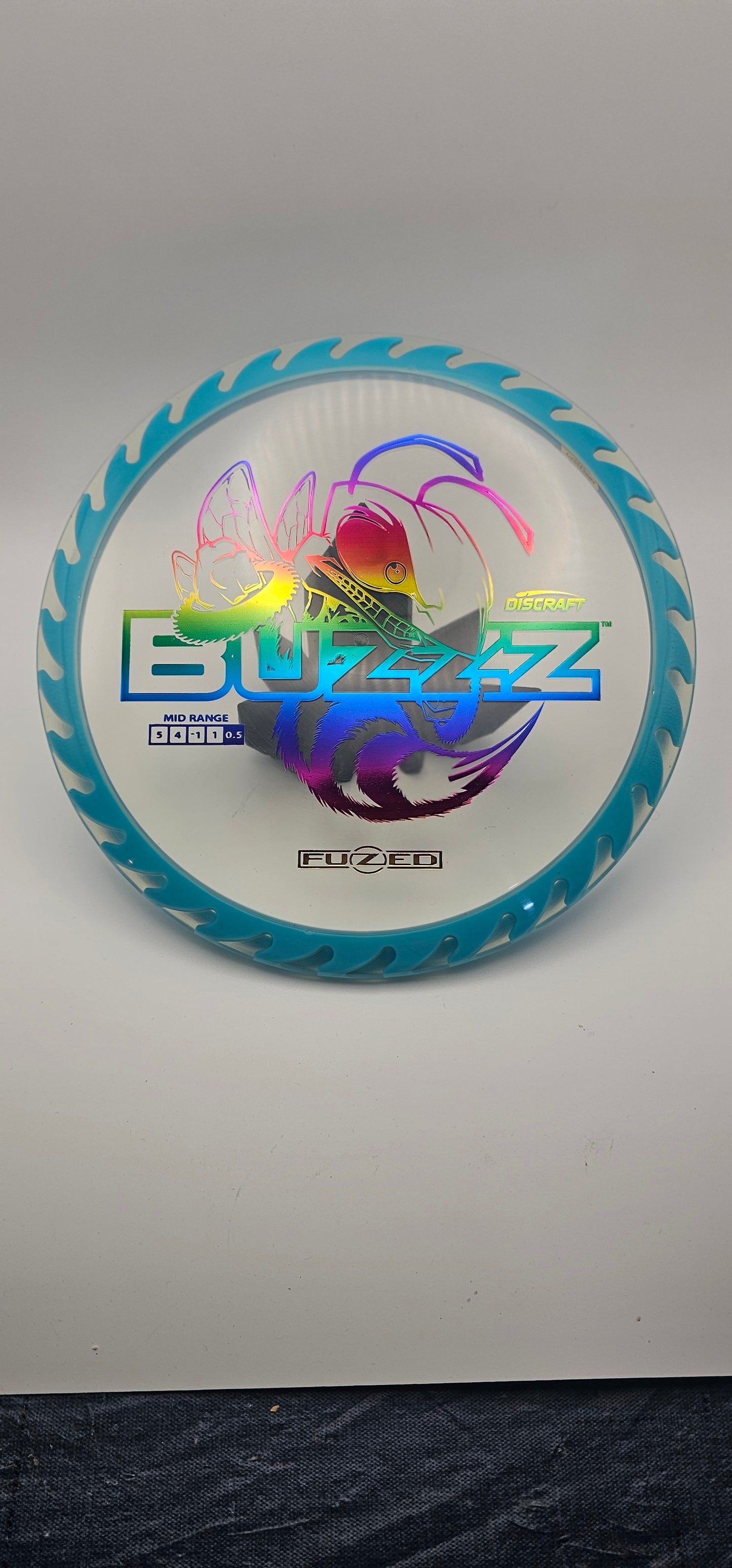 Discraft - FuZed Buzzz - Clear Plate - Blue blades - Buzzzsaw - 177g+ - rainbow foil
