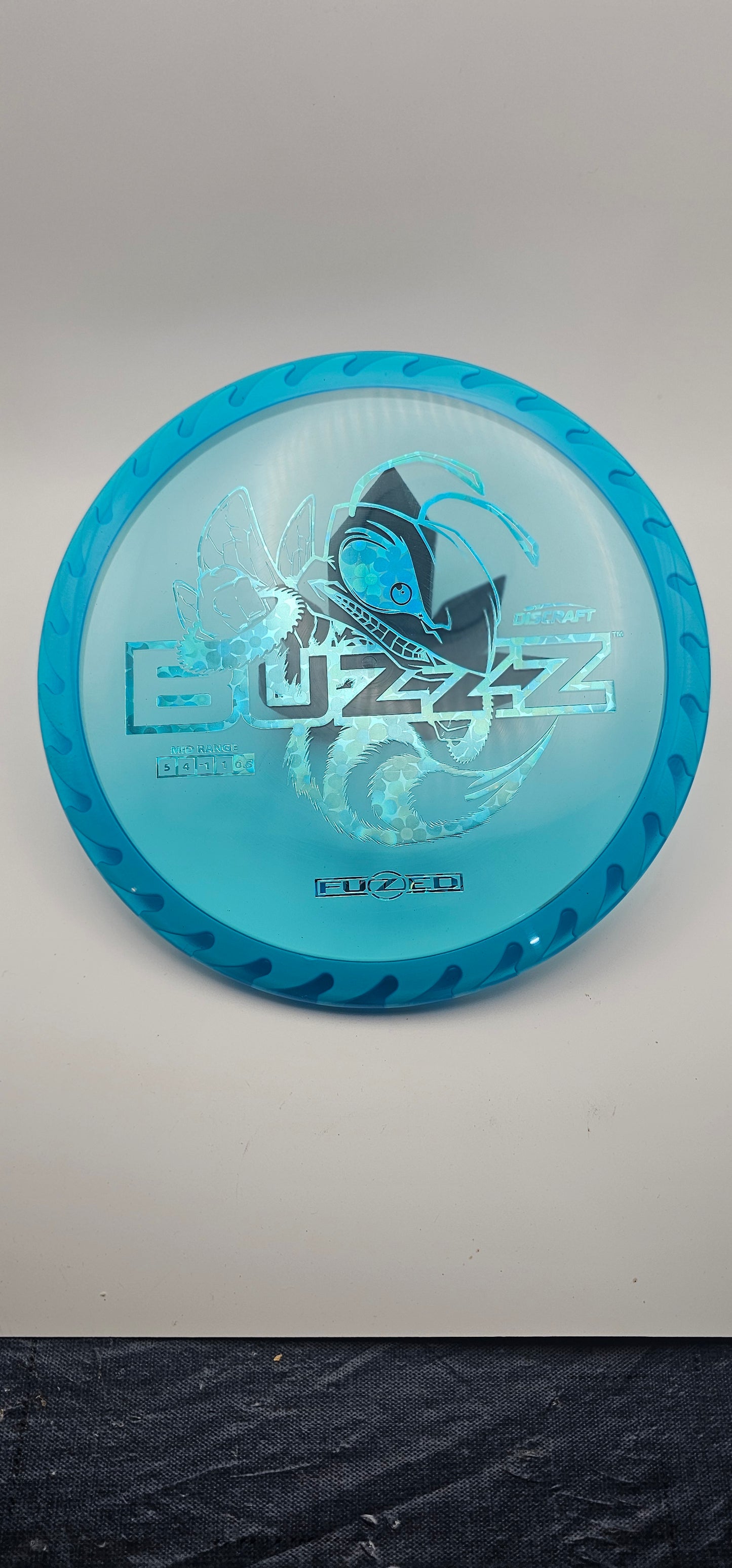 Discraft - FuZed Buzzz - Blue Plate - White blades - Buzzzsaw - 177g+ - blue flower foil