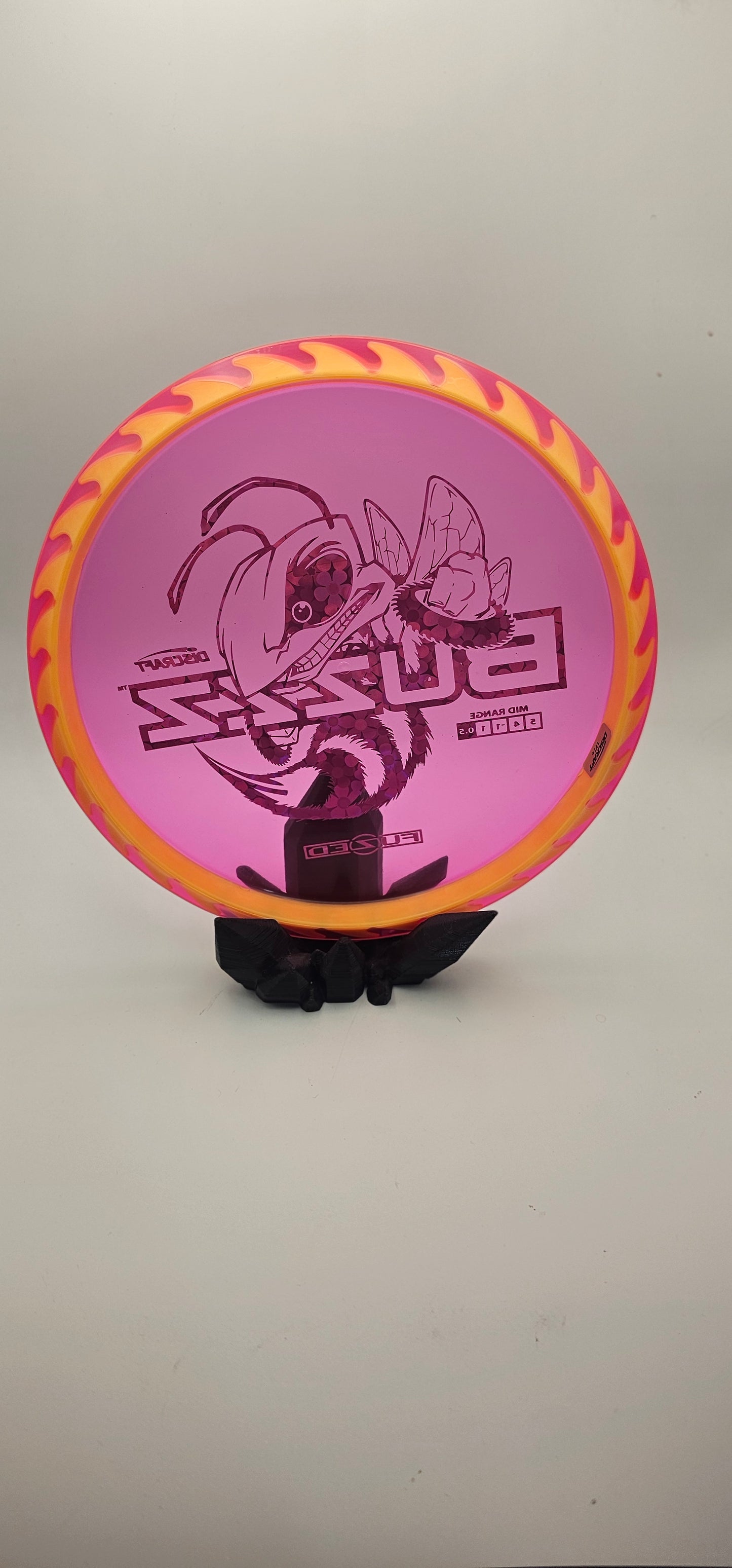 Discraft - FuZed Buzzz - Pink Plate - Yellow blades - Buzzzsaw - 177g+ - blue flower foil